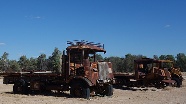 Rusting abandoned trucks in the desert