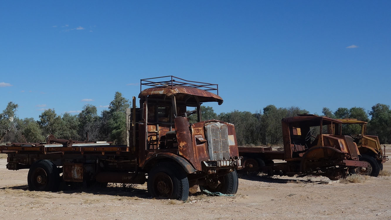 Rusting abandoned trucks in the desert